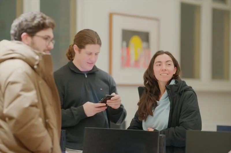 Gallery image: 01 talking 08 july sharing something on a phone.webp