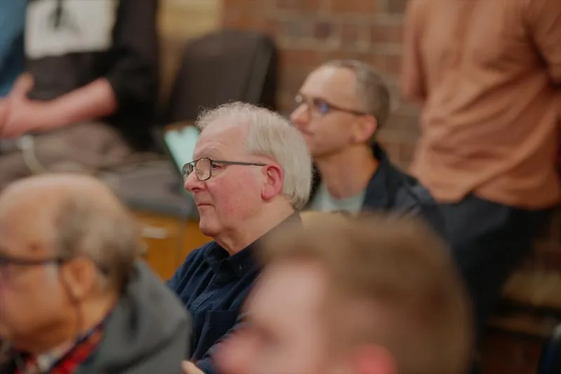 Gallery image: 02 listening 01 june members listening to a talk.webp