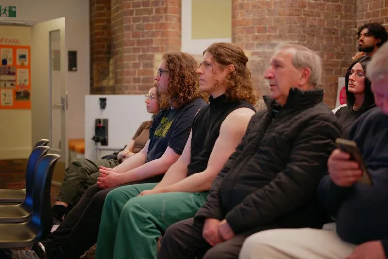 Gallery image: 02 listening 04 june a row of attentive faces.webp