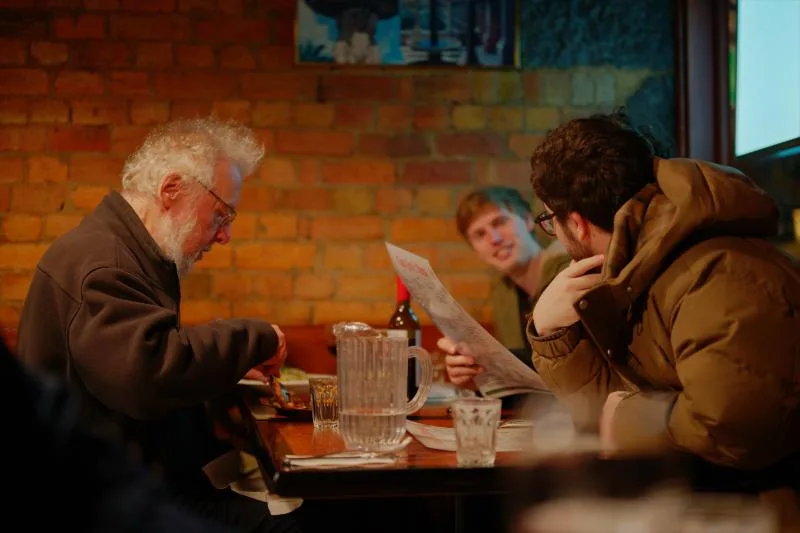 Gallery image: 03 pizza 03 july reading the menu together.webp