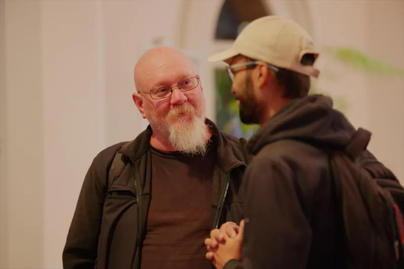 Gallery image: 01 talking 01 june two members in conversation.webp